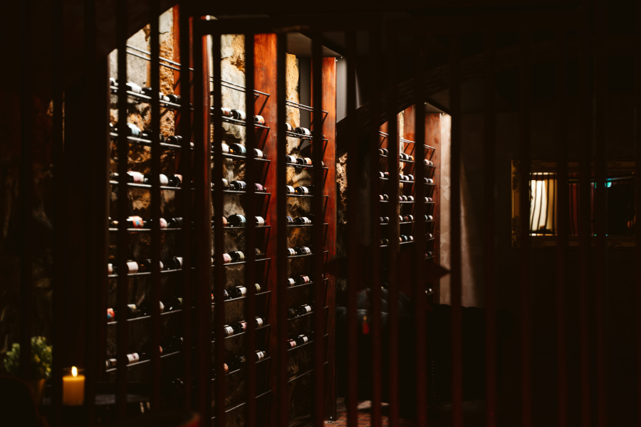 The Ruby Lounge wine cellar behind timber and stone